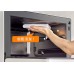 Panasonic NN-DS59RW 28L All-In-One Steam Convection Oven Panasonic NN-DS59RW oven interior being wiped clean with a cloth