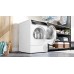 Bosch WQB246D1HK tumble dryer installed beside laundry shelves with the door open