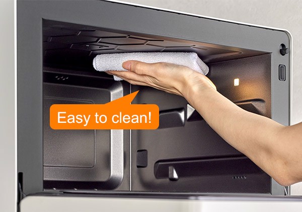 Illustration of wiping the NN-DS59RW cavity roof with a soft cloth