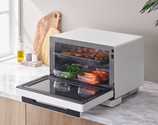 NN-DS59RW dual-level cooking illustration with meat grilling above vegetables and seafood steaming below